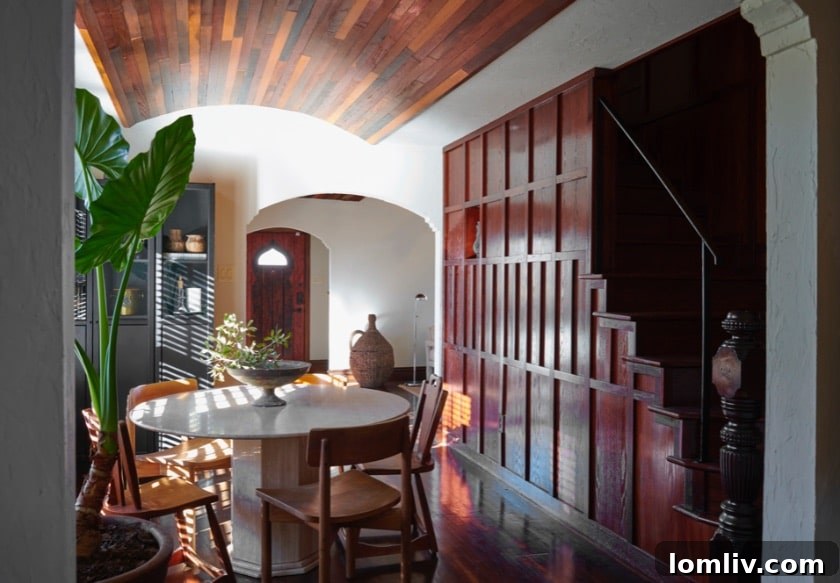 The Little House That Dared to Dream: A Quirky Gem's Bold New Look 5 Elizabeth Lavin: Renovated kitchen or dining area with unique lighting and Turkish design elements in the Carnes Street home