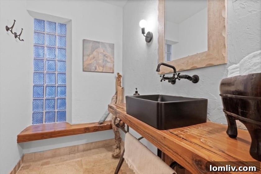 The Little House That Dared to Dream: A Quirky Gem's Bold New Look 8 Daydream Photography: Modern bathroom with intricate tile work and wooden accents designed by Kate Murphy in the Carnes Street home