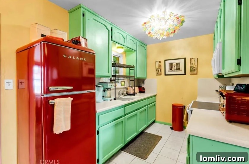 California's Vibrant Embrace: A Home That Feeds the Soul 12 Modern, fully equipped kitchen with colorful accents and stylish refrigerator