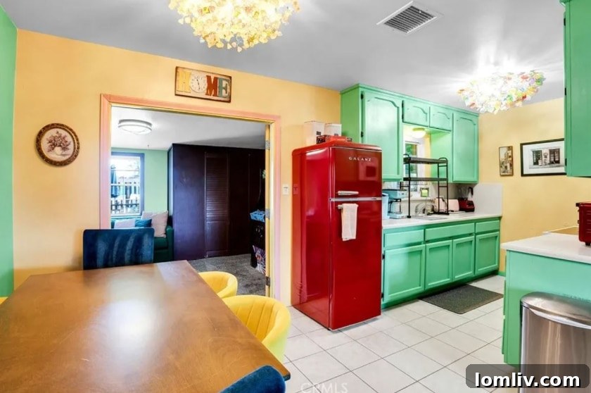 California's Vibrant Embrace: A Home That Feeds the Soul 13 Detail of a unique, custom-painted refrigerator adding character to the kitchen
