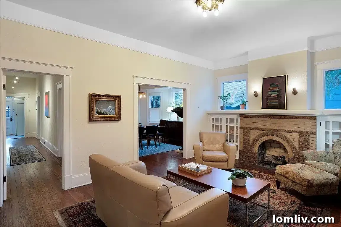 Academic Growth Spurs Dallas Housing Demand 11 This Craftsman house showcases original hardwood flooring, impressive 10-foot ceilings, and a distinctive Craftsman fireplace, highlighting its unique architectural character.