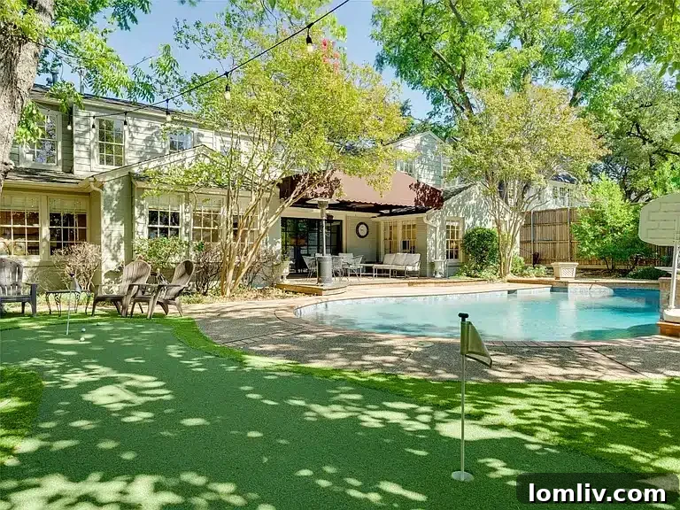 Academic Growth Spurs Dallas Housing Demand 8 This Dallas home boasts a spectacular backyard with a pool and putting green, making it a perfect spot for entertaining friends and creating lasting memories.