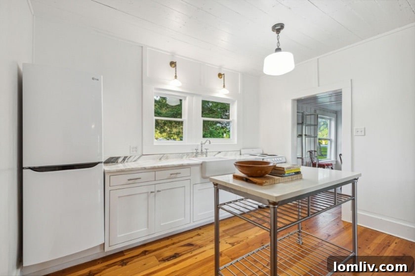 Claim Your Three Acres of Kaufman's Legacy at The Thurman Place 14 Cozy kitchen space with modern updates in the charming guest house