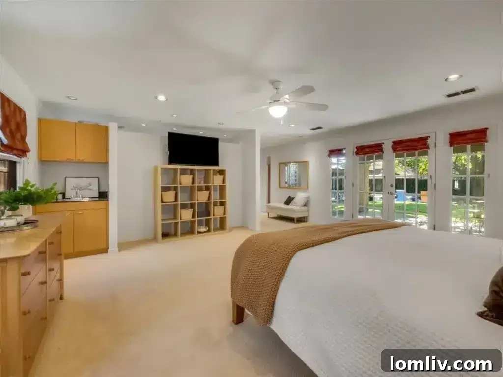 Luxurious primary bathroom with elegant double vanities, an oversized walk-in shower, and a serene soaking tub for ultimate relaxation.