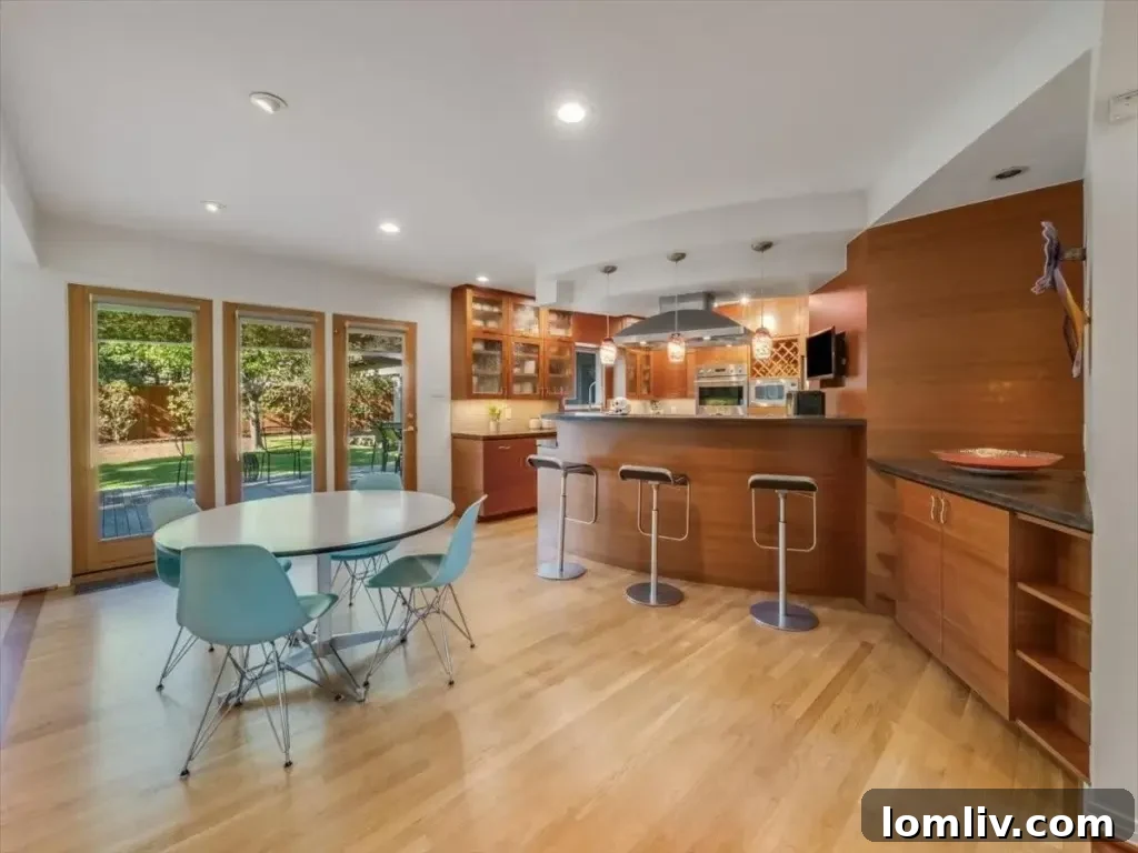 Another perspective of the inviting family room, highlighting its spaciousness and natural illumination.