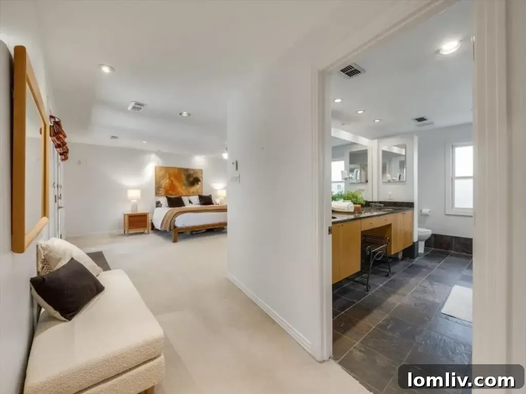 Another view of the sophisticated kitchen, showcasing the gourmet stainless steel appliances and custom millwork.