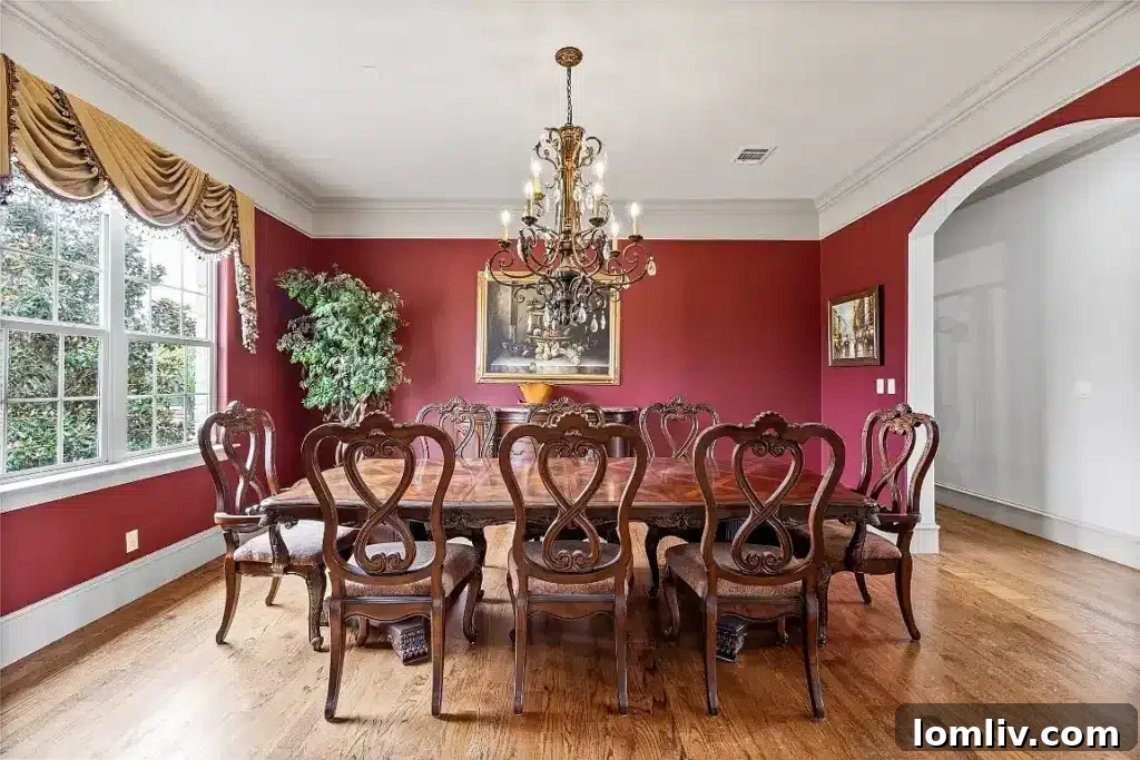 The 7,700-Square-Foot Celina Palace: Where Grandeur Reigns 6 An expansive open-concept living area with a grand fireplace, plush seating, and large windows overlooking the estate.