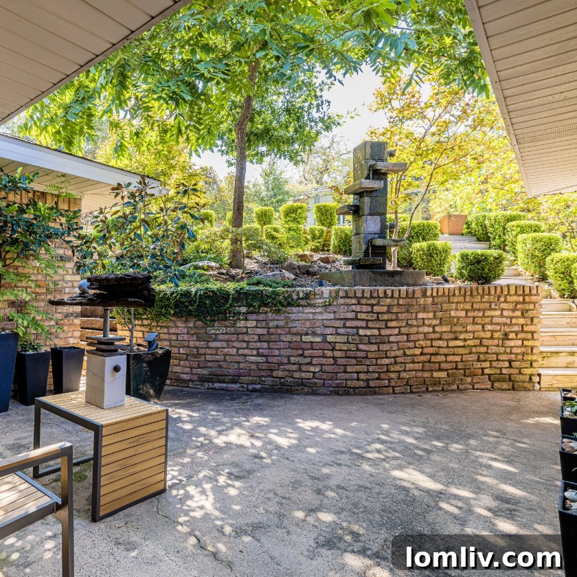 Bonnywood A Must-See on This Years Heritage Oak Cliff Home Tour 7 A serene Buddha statue nestled among lush greenery, embodying peace and tranquility in a garden setting.