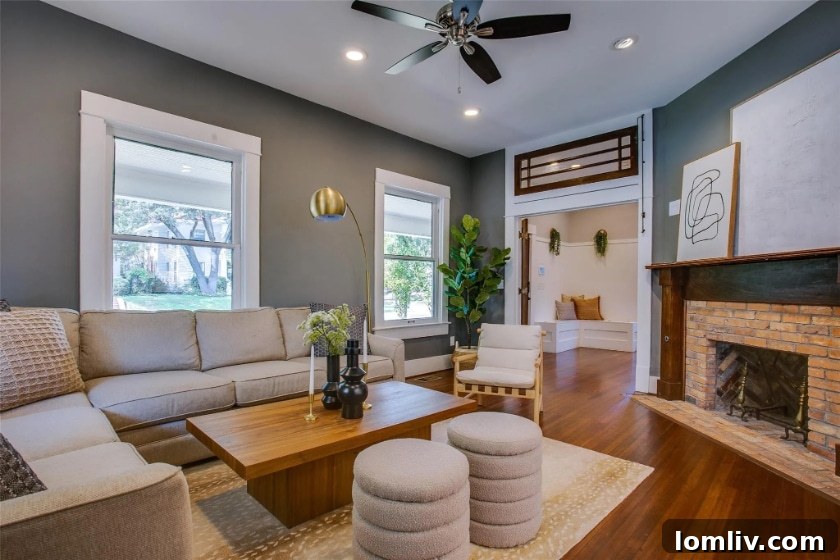 Side view of the charming Winnetka Heights American Four-Square home with its welcoming, period-appropriate porch