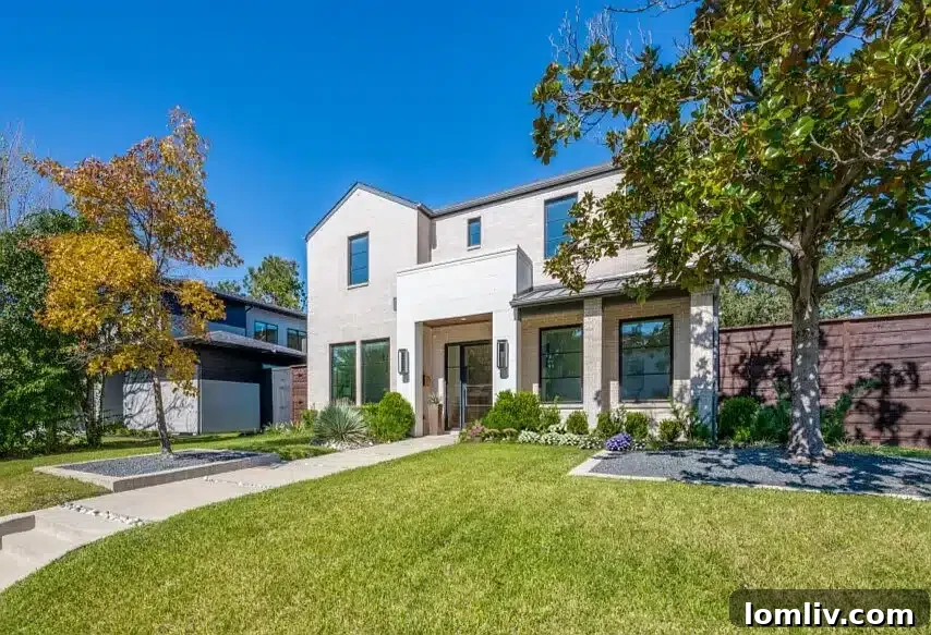 Ridgecrest Village: A Modern Masterpiece 3 The impressive modern facade of 3895 Durango Drive, featuring geometric lines, gas lanterns, and a custom metal door.