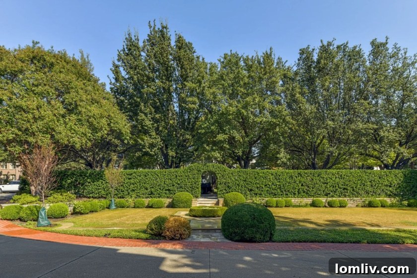 Unveiling Hal Thomson's Highland Park English Country House: A Wilson Fuqua Exploration 9 Lush Boxwood Hedge and Pathway Leading to the English Country House