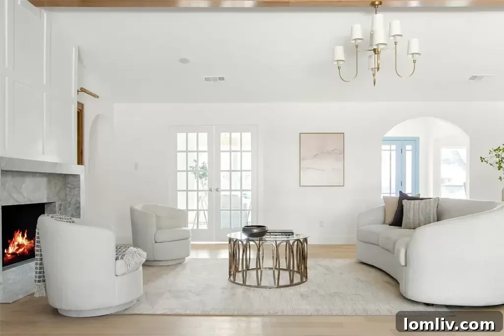 A cozy living room featuring a warm fireplace, plush seating, and tasteful decor, ideal for a relaxing Thanksgiving morning.
