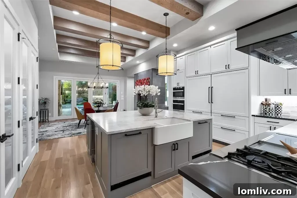 An opulent kitchen featuring rich wood beams, a spacious island, and elegant countertops, perfect for holiday cooking in Frisco.