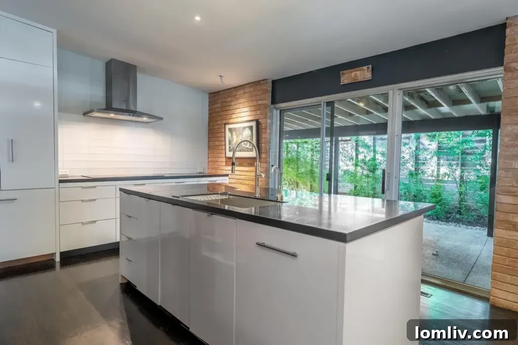 Modern kitchen with original walnut cabinetry and updated appliances in the Hamilton home