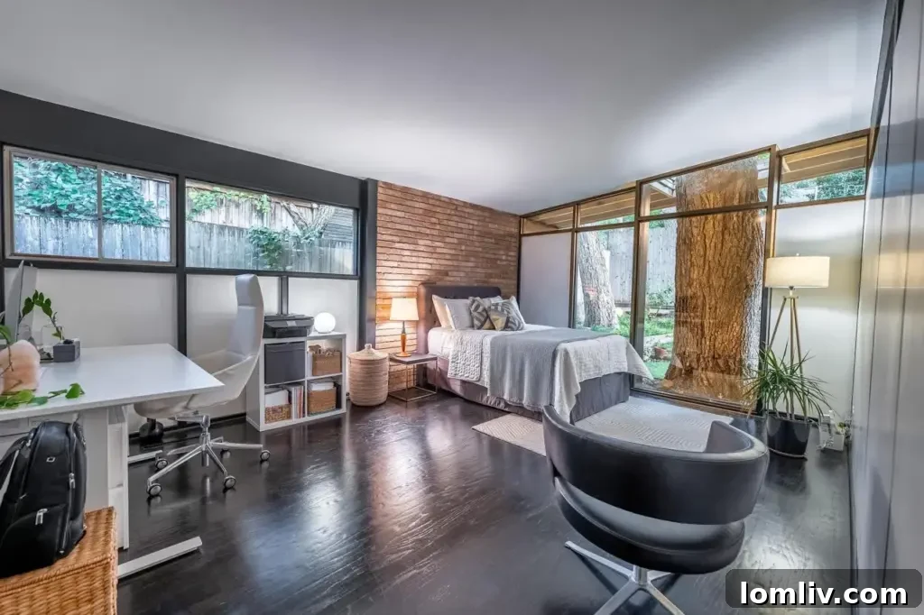 Primary bedroom with courtyard view and built-in storage in the Hamilton home