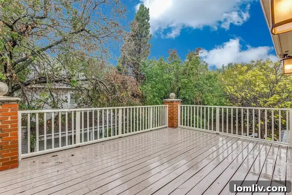 Charming backyard with mature trees, lush landscaping, and seating area for relaxation