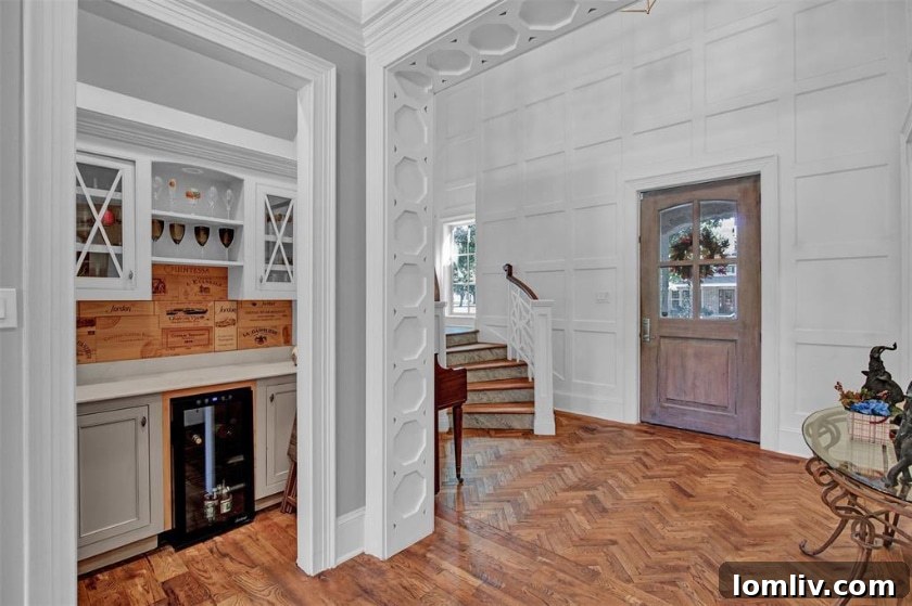 Elegant living area entry with decorative octagonal relief in Midway Hills Modern Tudor
