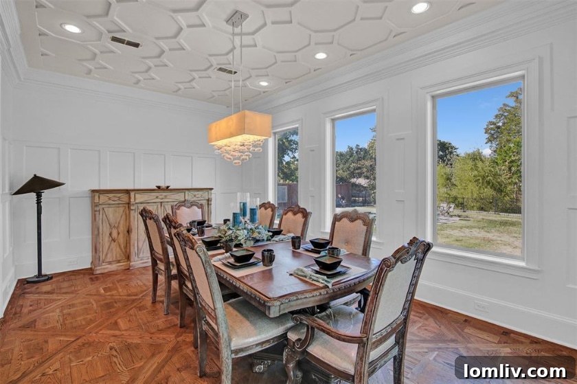 Formal dining room with elegant coffered ceilings in Midway Hills Modern Tudor