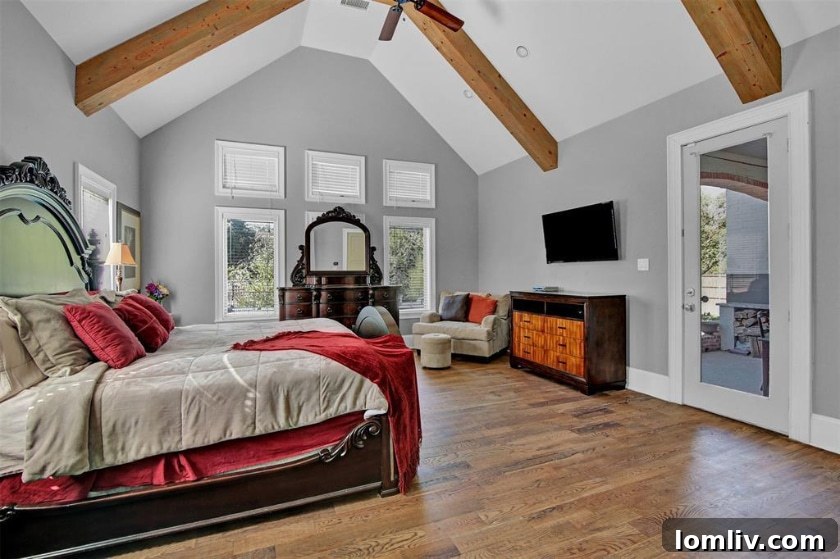 Luxurious primary suite with patio access in Midway Hills Modern Tudor