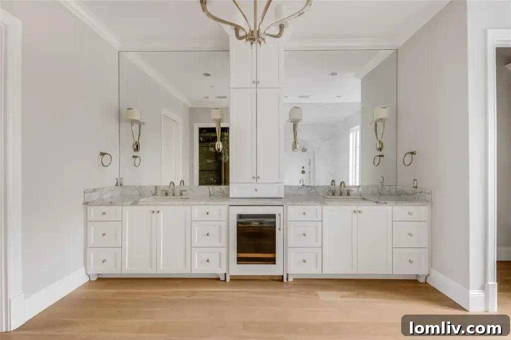 Luxurious primary bathroom with exquisite marble finishes and a custom coffee bar.