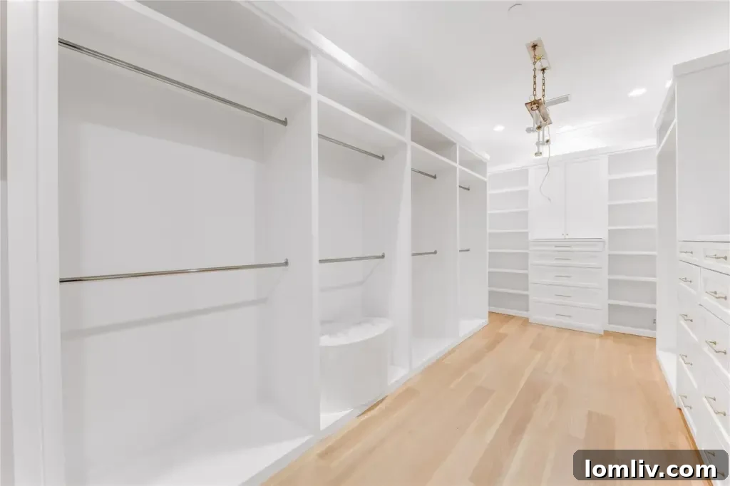 Spacious walk-in closet in the primary suite, featuring ample storage and thoughtful amenities.