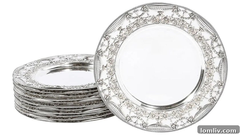 A close-up of a luxurious silver charger plate from Christofle, reflecting the light and adding a touch of grandeur to the table.