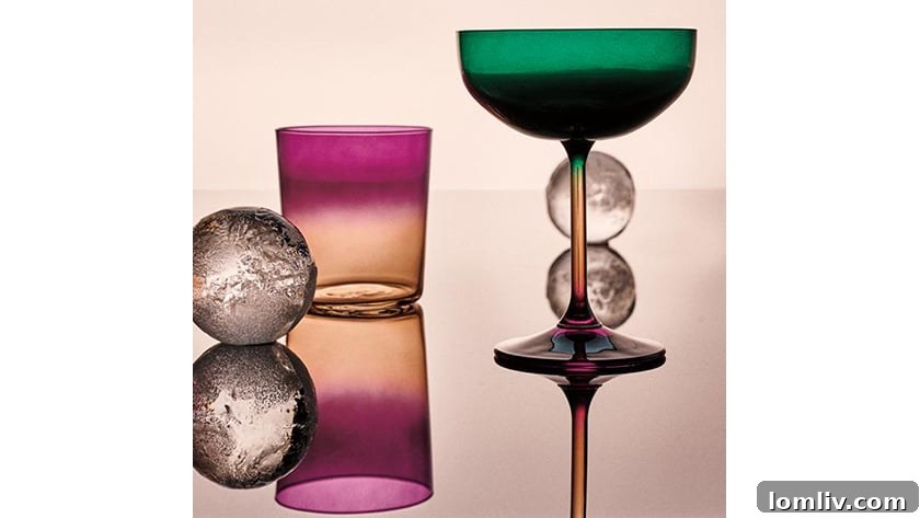 A collection of colorful and varied drinking glasses, suggesting a vibrant and eclectic approach to beverage service.