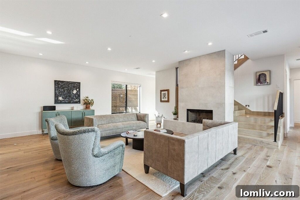 Feast-Ready Spaces: Open Houses Boasting Proper Dining Rooms 8 Living room with stone fireplace designed by Douglas Hildinger