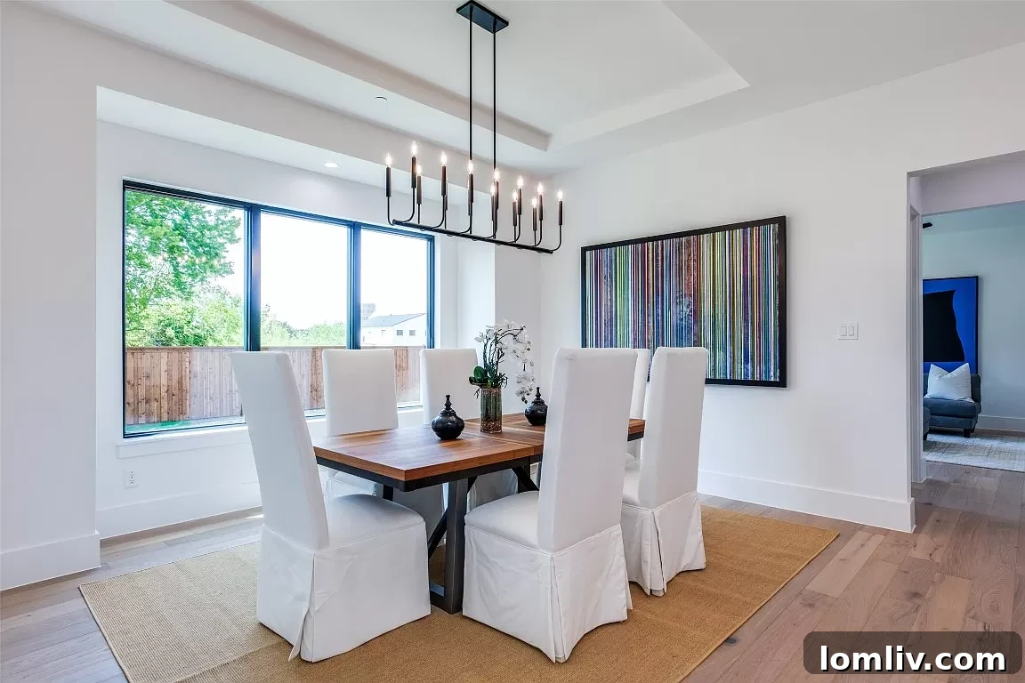 Feast-Ready Spaces: Open Houses Boasting Proper Dining Rooms 9 Modern dining room with contemporary light fixture