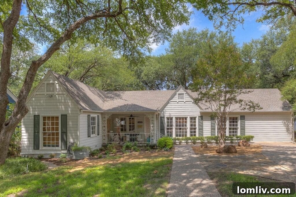 Inviting living room in Brittany Cobb's Fort Worth bungalow, featuring light-filled spaces and stylish decor.
