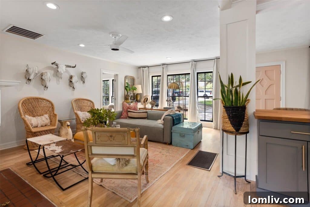 Cozy seating area with a fireplace in the Oakhurst bungalow, reflecting a blend of vintage and modern.