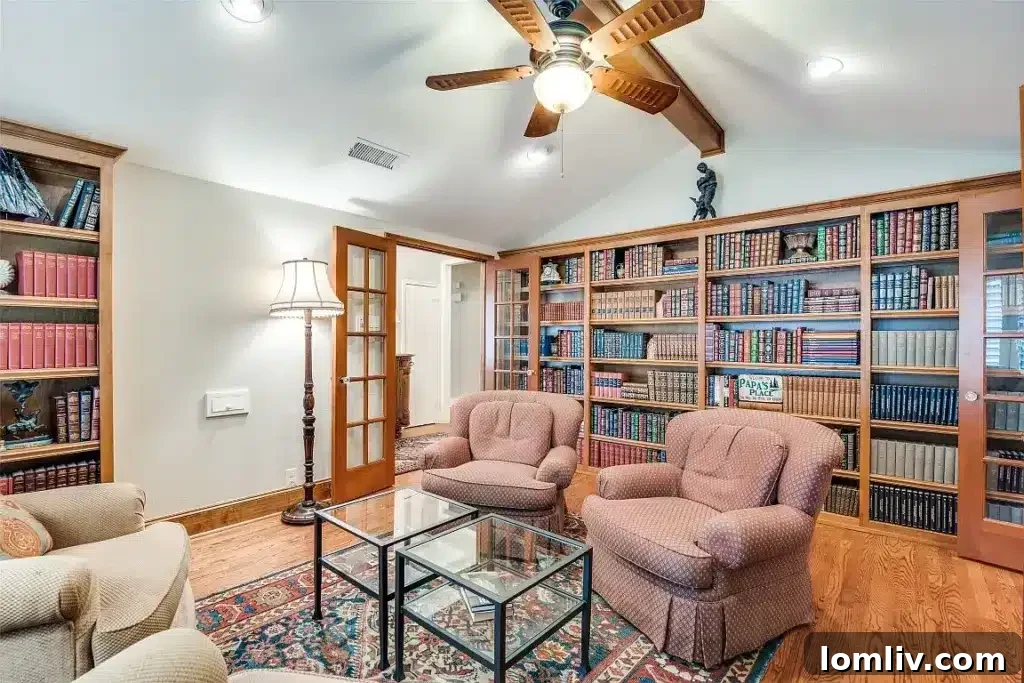 Elegant formal library adorned with custom shelving, creating a perfect retreat for reading or work.