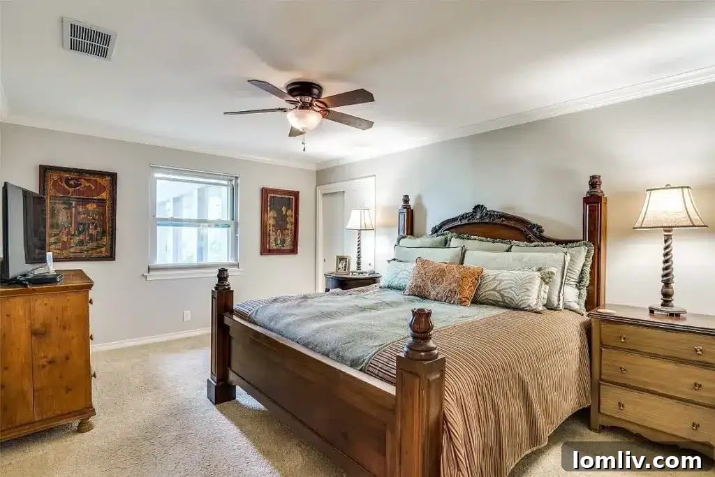 Luxurious primary bedroom featuring ample natural light, spacious layout, and a tranquil ambiance.