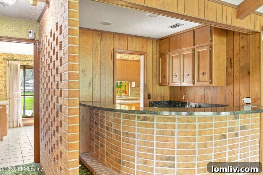 Close-up of a stylish Midcentury Modern home bar with classic design elements and glassware