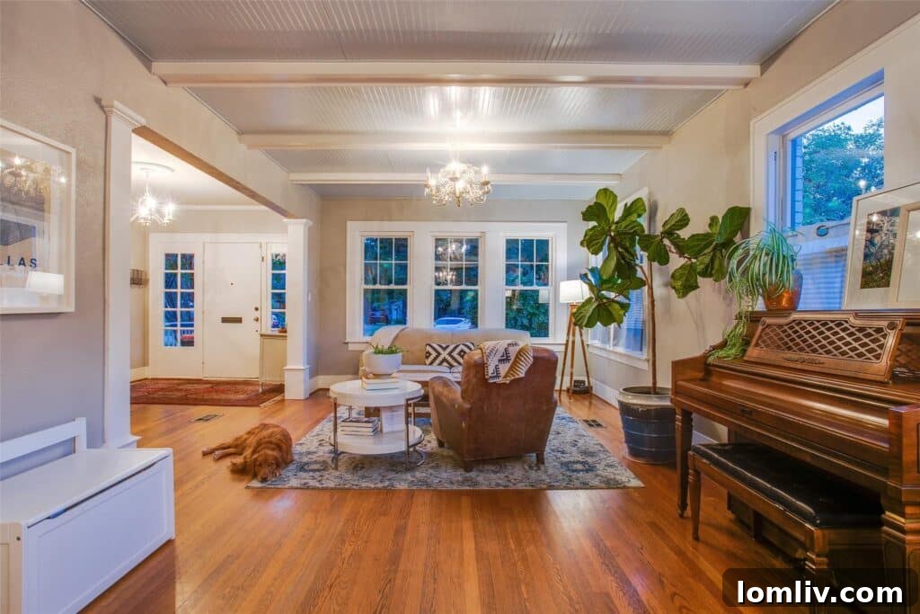 Interior view of a spacious living room with hardwood floors and elegant decor in a Kessler Park home.