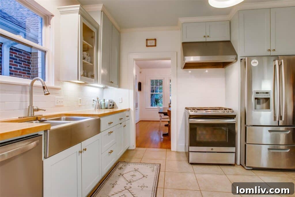 Updated kitchen with Shaker cabinets, butcher block countertops, and a farm sink in the Kessler Park home.