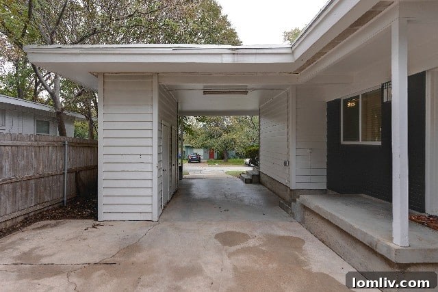 Driveway and carport area showcasing its potential for outdoor entertaining and gatherings