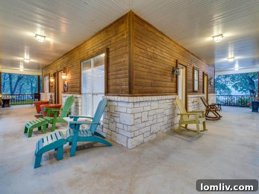 Charming and inviting front porch, adorned with carefully curated landscaping, providing a peaceful entry to the luxury ranch home.