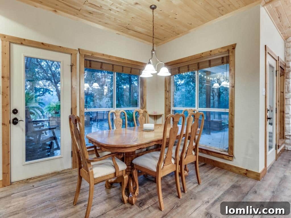 Bright and airy dining area, situated adjacent to the kitchen, offering a perfect setting for both casual meals and formal dining experiences.