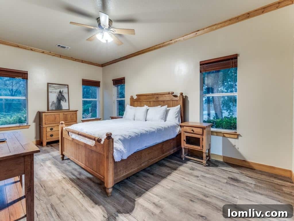 Luxurious primary bathroom featuring a grand soaking tub, elegant tiled shower, dual vanities, and abundant natural light, creating a spa-like retreat.