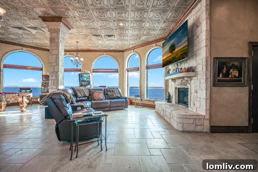 Lake Whitney's Parsons Castle A $5.5 Million Fairytale Ready for Its Next Chapter 13 Parsons Castle's distinctive architecture illuminated at dusk, showcasing its elegant white walls and red tile roof against the evening sky.