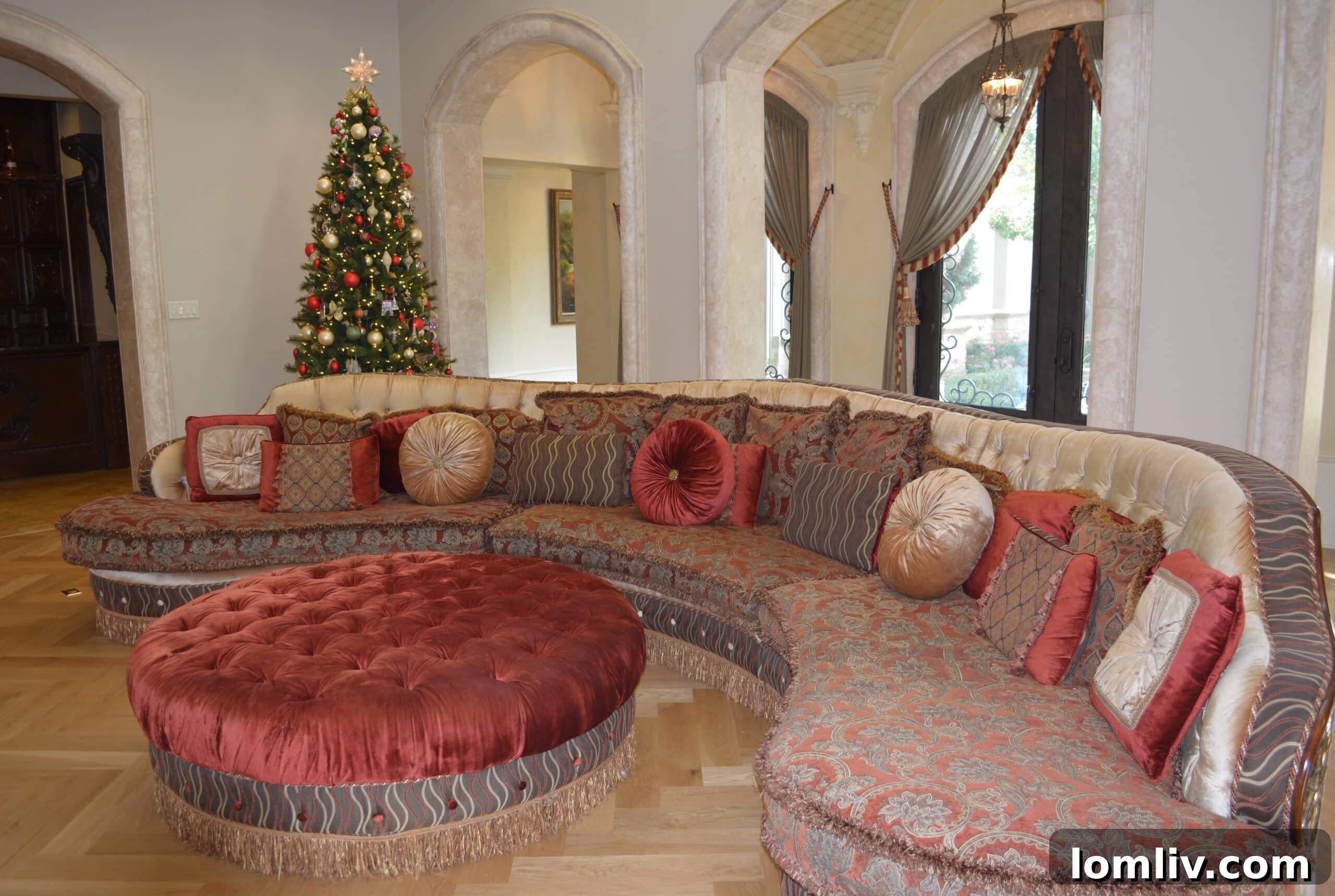 Colleyville Holiday Homes Today, Southlake Tours Next Week 6 A vibrant red Christmas tree with matching decorations enhancing a stylish living area in a Colleyville home, creating a harmonious festive theme.