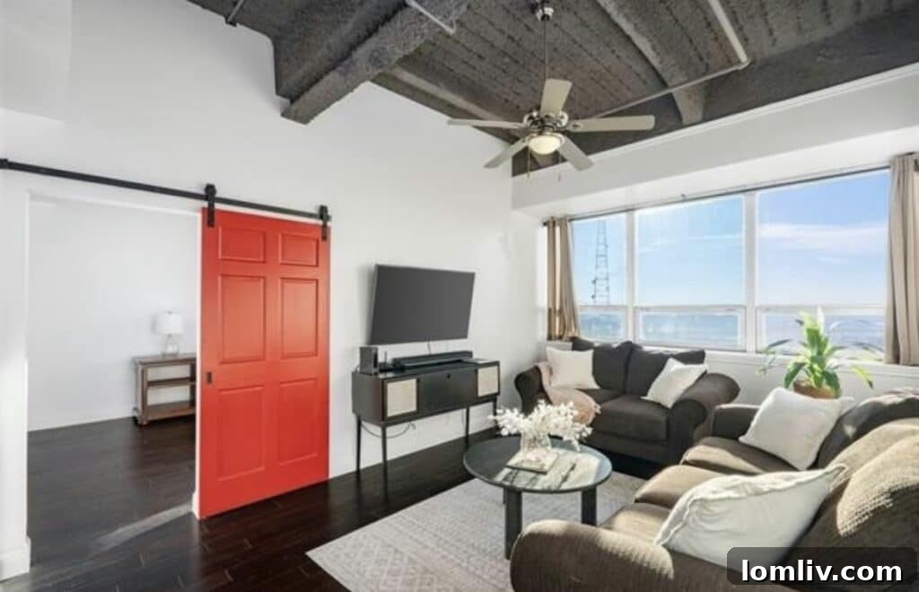 Modern gourmet kitchen with granite countertops, stainless steel appliances, and a spacious island, providing a perfect setting for culinary enthusiasts in a high-end Dallas condo.