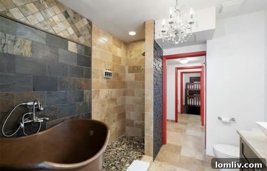 Elegant spiral staircase crafted from African mahogany wood, leading to a private rooftop terrace, highlighting unique architectural features of the 511 N. Akard St. luxury residence.