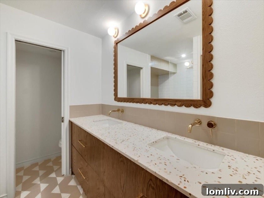 East Dallas's Newest Marvel by Sunscout Studio 11 A contemporary bathroom with clean lines and high-end finishes, reflecting the home's luxurious design.