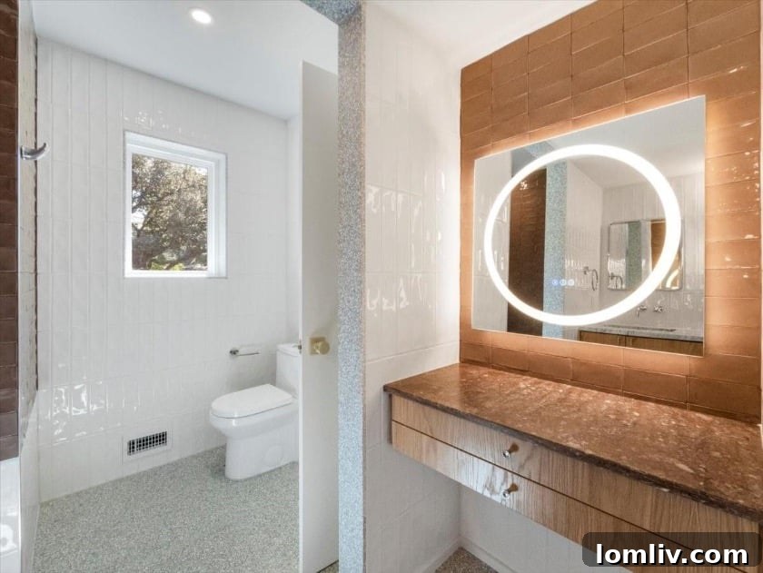 East Dallas's Newest Marvel by Sunscout Studio 10 A brightly lit upstairs room with a skylight, showcasing its versatility as either a bedroom or a game room.