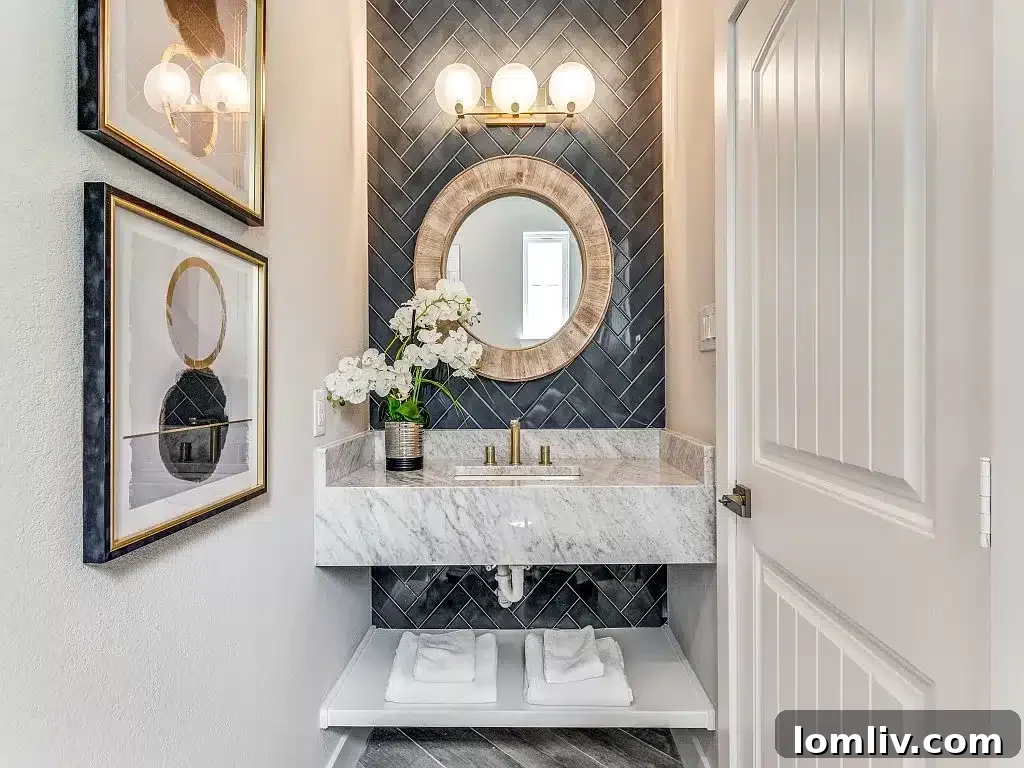 A bathroom at 5409 Pershing Avenue showcasing custom tilework and a contemporary floating vanity, highlighting the home's unique design.