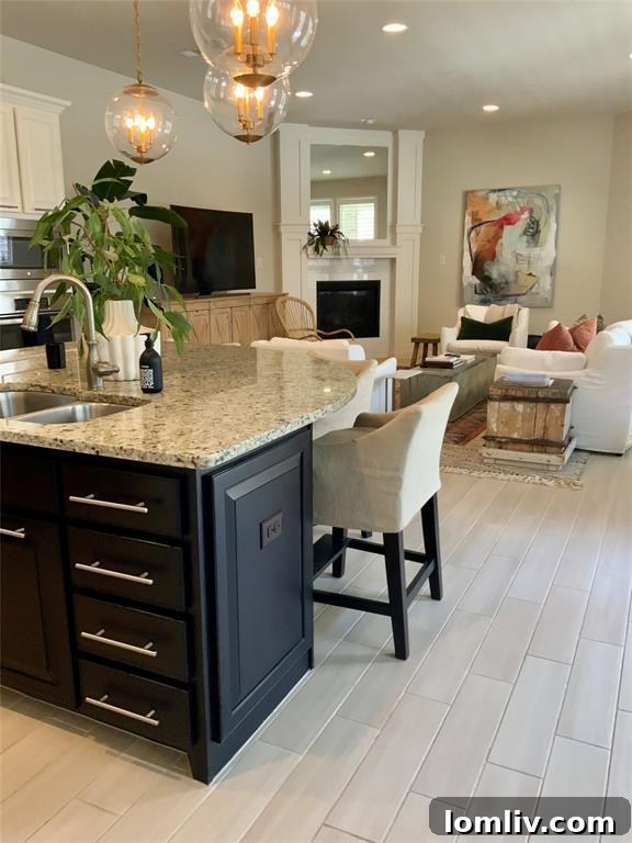 Upgraded kitchen island with a stylish design, offering convenient casual dining at the 1005 Ivory Trail townhouse.