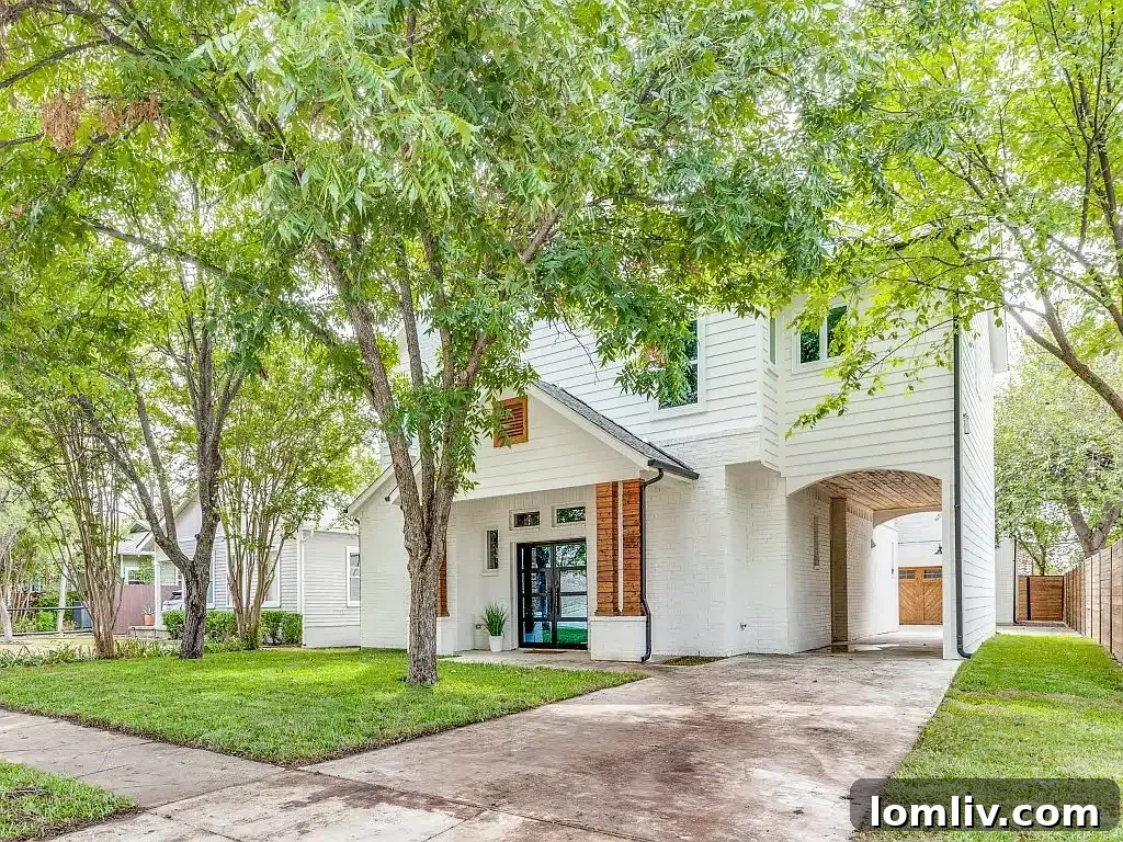 Elegant white two-story home at 5409 Pershing Avenue, Fort Worth, featuring mature pecan trees, completed in 2020.