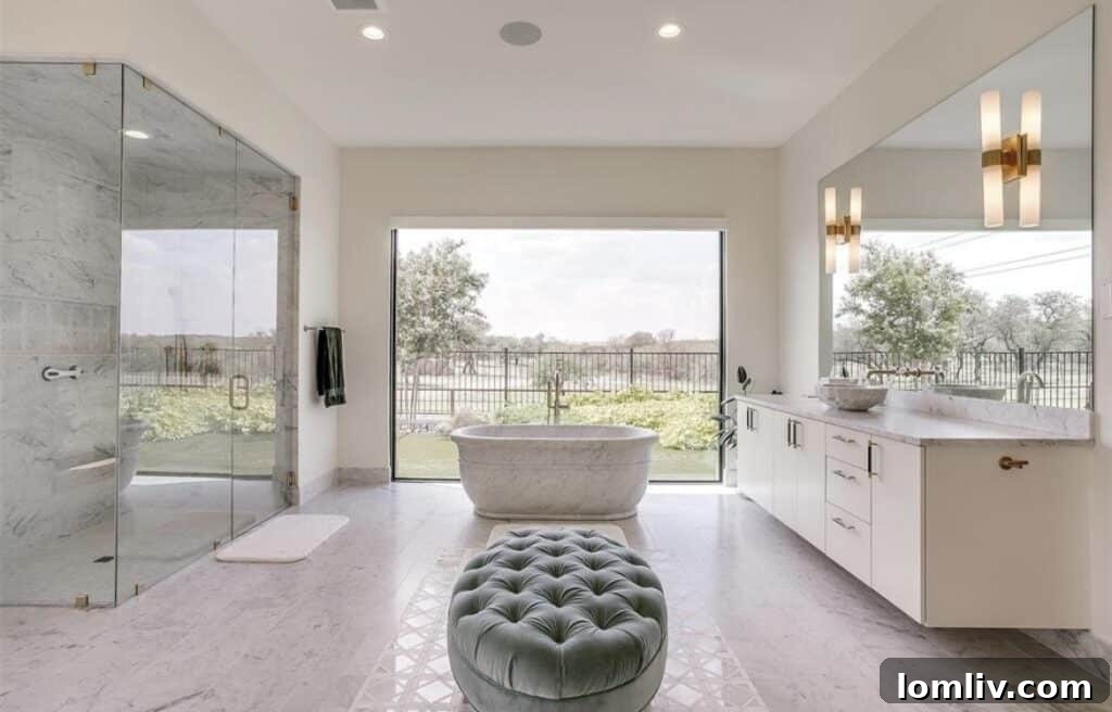 Fort Worth's Luxury Landscape: Expansive Estates Flourish in Texas' Fastest-Growing City 10 The luxurious master bathroom featuring heated marble floors and a spacious soaking tub, embodying ultimate comfort.